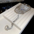 Close-up of sparkling rhinestone finger bracelet with multilayer silver crystal chains - Silver
