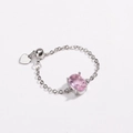 Detail of pink oval zircon ring with silver chain and a small heart pendant charm - Pink Zirconia - Silver