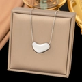 Elegant silver stainless steel heart necklace displayed on a premium jewelry box - Geometric Heart / Steel