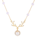 Golden reindeer necklace with pearls and sparkling crystals on a white background - KC Gold 6118