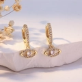 Gold huggie hoop earrings with evil eye charm and clear cubic zirconia pavé - Gold Evil Eye