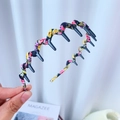 Floral fabric wrapped headband with teeth, featuring yellow and purple flower patterns - Protective Cover Style / Black Floral