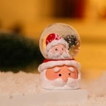 Detail of Christmas crystal ball featuring Santa Claus design and snowy glitter inside - New Style Santa Claus Snow Globe