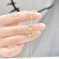 Elegant gold double heart necklace with dancing zircon stone and sparkling pavé crystals - Moving Heart