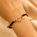 Macro detail of braided Virgin Mary heart bracelet with gold cross and zircon stones - KC Gold Black Rope (G-455)