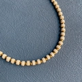 Handmade beaded necklace with creamy white cylindrical beads and gold metal spacers - 4#