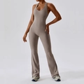 Slim fit terracotta yoga bodysuit featuring a halter V-neck and stylish flare leg cut - S / Flaxen