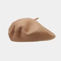 Detail of high-quality wool beret in light brown showing premium fiber texture - Camel