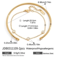 Macro detail van de 18K goudvergulde roestvrijstalen armbandset met maataanduidingen - Goud Tweedelige Stijl