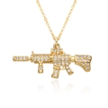 Detailed view of a gold-plated rifle pendant encrusted with sparkling white cubic zirconia - Rifle Shape Trend Style (h235)