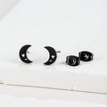 Detail view of black stainless steel moon and star stud earrings on white stone - 029 Moon Star / Black