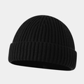 Close-up of black ribbed knit texture on a classic brimless docker beanie hat - Black