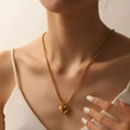 Golden stainless steel beaded bracelet with a 3D heart charm on female model - 14mm Gold Bead Chain Heart Necklace (I413)