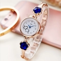 Women's quartz watch in rose gold with blue flower crystals and heart dial design - Gold Band + Dark Blue Crystal