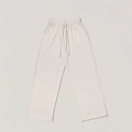 Dettaglio dei pantaloni in maglia a coste beige con elastico in vita e coulisse - XS / Bianco neve