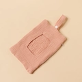 Detailed view of pink cotton muslin baby wipe organizer with hanging snap strap and zipper - Light Pink