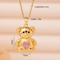 Collana con orso dorato e zircone rosa a forma di cuore su catena a maglie di 45 cm - Orso d'oro con cuore rosa (2723)