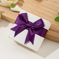 Elegant white textured jewelry gift box featuring a deep purple satin ribbon bow - 7*7*3.5cm / Purple Bow