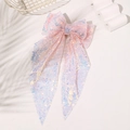 Close-up of pink mesh hair bow with iridescent sequins and long streamers - Light Pink