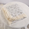 Detailed view of soft cotton baby blanket featuring leaf print and decorative tassel fringe. - 100*120 cm / Maple Leaf