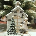 Resin Christmas village scene with church, snowy tree and caroling children figurines - Christmas Tree House (Light Up)