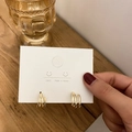 Minimalist multi-layered gold S925 silver hoop earrings shown on a display card - 3D Multi-Loop C-Shape Studs / Gold
