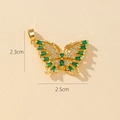 Macro detail of gold butterfly pendant with green zircons and size dimensions 2.3x2.5cm - Z-Green Stone Gold Butterfly (2.3x2.5cm)