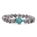 Grey jasper beaded bracelet with a vintage turquoise turtle charm on white background - Map Stone