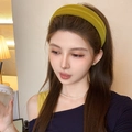 Close-up of a mustard yellow velvet padded headband for women with premium textured finish - Yellow