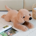 Plush Labrador dog doll in a soft light brown finish lying on a cozy white rug - Light Coffee / 40CM