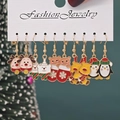 5-pair Christmas earring set with reindeer and penguin charms on a white card display - Style 31 (5 Pairs Set)