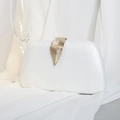 Elegant pearl white PU evening clutch bag with golden leaf metal clasp on silk background - White