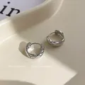 Silver geometric earrings with quilted pattern on a minimalist jewelry tray - Silver Quilted Pattern Hoop (E027)