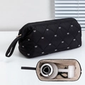 Detail of quilted hair dryer storage bag with bow embroidery showing large inner capacity - Black