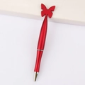 Red metal ballpoint pen with heart-shaped butterfly ornament on white background - Butterfly / Red