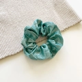 Metallic green silk scrunchie with soft pleats on a textured cream background - Medium / Tiffany Green