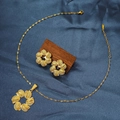 Detailed view of golden flower jewelry set including necklace and earrings on silk - E6107-4/Gold Minimalist Geometric
