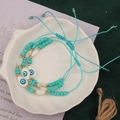 Detail of turquoise beaded bracelet set with devil eye pendant and braided drawstring - Style 20-3pcs Blue Eye Set