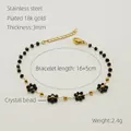 Detalle de la pulsera de acero inoxidable chapada en oro 18K con flores de cristal - Negro (Pulsera)