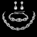 Silver bridal jewelry set with wave necklace, bracelet, and drop earrings on black background - 778 Silver Three-piece Set