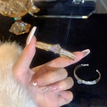 Elegant gold-plated open bangle featuring a 3D rose and sparkling pave zircon crystals - Gold Rose Zirconia Bangle (A2135)