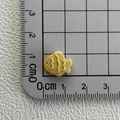 Close-up showing a 1.5cm yellow resin fish charm measured on a metric scale ruler - Fish Biscuit