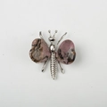 Pink natural stone butterfly wing brooch with silver alloy metal trim details - Rhodochrosite