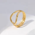 Minimalist double-layered gold wave ring on a white geometric stone pedestal - Size 7 (Adjustable) / Gold