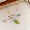 Close-up of green apple pendant necklace with colorful beads on a silver-tone chain - Titanium Steel Cats Eye Glass Bead Apple Pendant Necklace