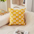 Modern yellow tufted floral throw pillow on beige sofa with minimalist home decor - Yellow Floral