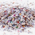 Close-up of mixed colorful irregular glass stones for DIY crafts and nail art decor - Style 11