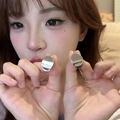 Polished silver 925 sterling silver post oval geometric earrings on a female model - A2728 Silver