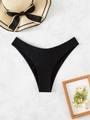 Chic black V-cut bikini bottom on marble background with elegant summer beach straw hat - Black