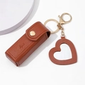 Brown leather lipstick pouch with gold snap button and heart charm keychain - Coffee